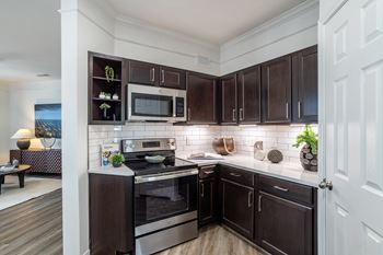 Kitchen with dark brown cabinets